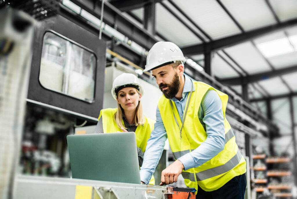 Two employees excited using LMS system.