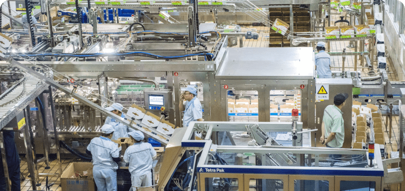 Employees in food production facility looking at Control of Listeria monocytogenes