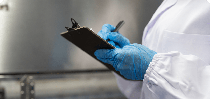 Close up view of employee with clipboard for Internal Safety Audits for-Food Processors