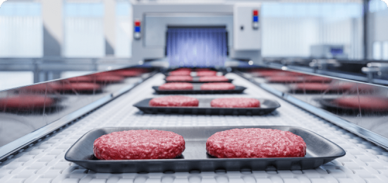 Raw meat on conveyer belt demonstrating Foreign Material Control.